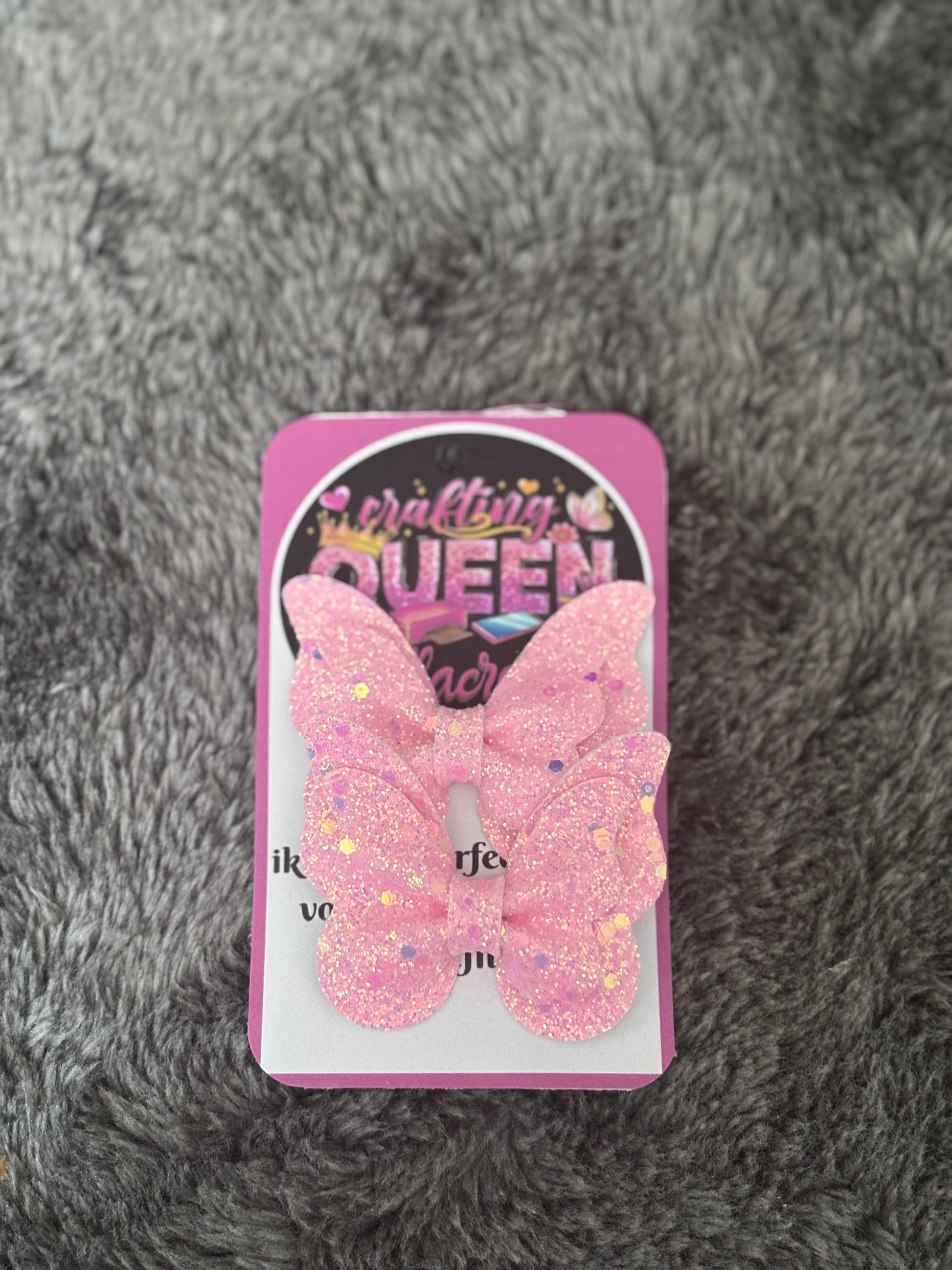 Glitter vlinder haarstrikje roze