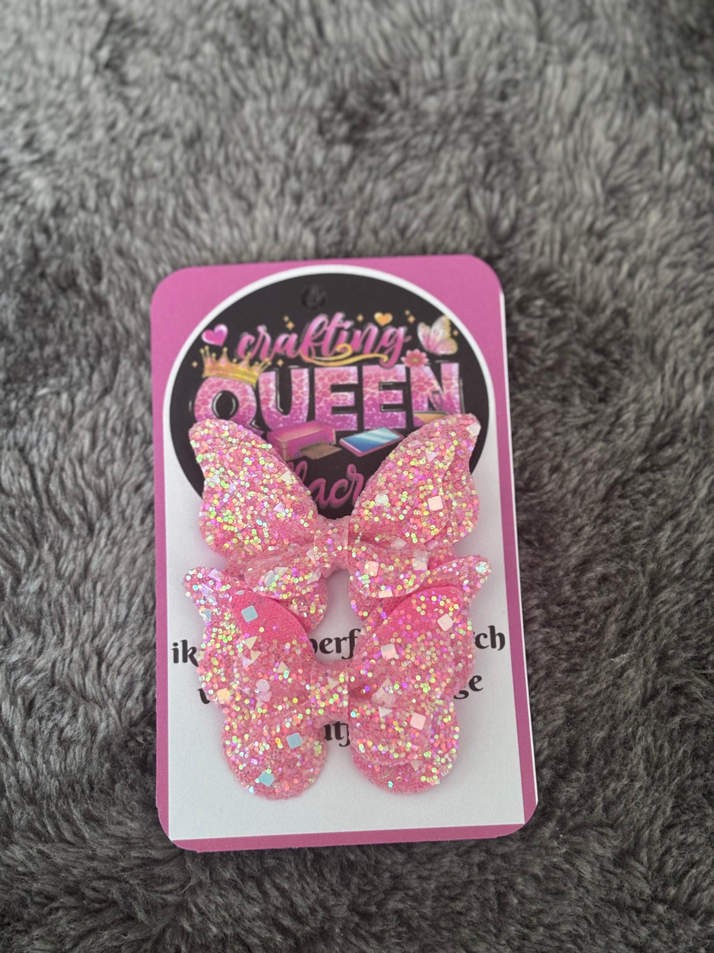 Donker roze glitter vlinderstrikje